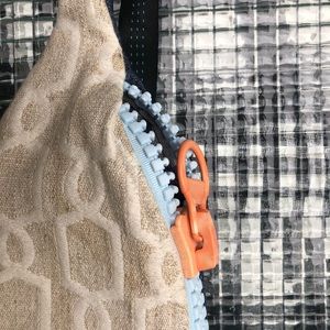 Reclaimed cross fanny pack with hemp tag and upholstery fabric.